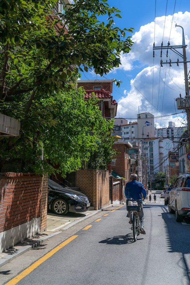 a man riding bicycle in the street in Korea