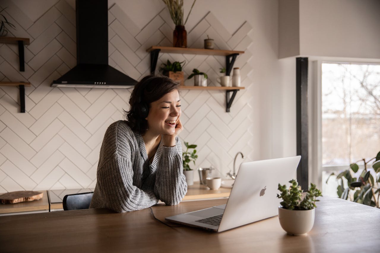 smiling-woman-talking-via-laptop