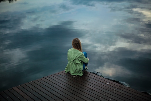 woman looking at the river